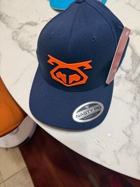 Nasty Pig Navy Cap with Bright Orange Emblem